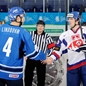 UFA, RUSSIA – JANUARY 4: Finland's Petteri Lindbohm #4 and Slovakia's Karol Korim #28 shake hands during relegation round action at the 2013 IIHF Ice Hockey U20 World Championship. (Photo by Richard Wolowicz/HHOF-IIHF Images)